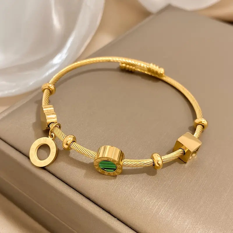 Rhian – Armband Gold Signatur