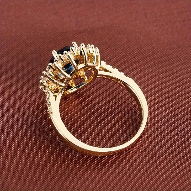 Delphine – Goldener Chic-Ring mit Blauem Stein