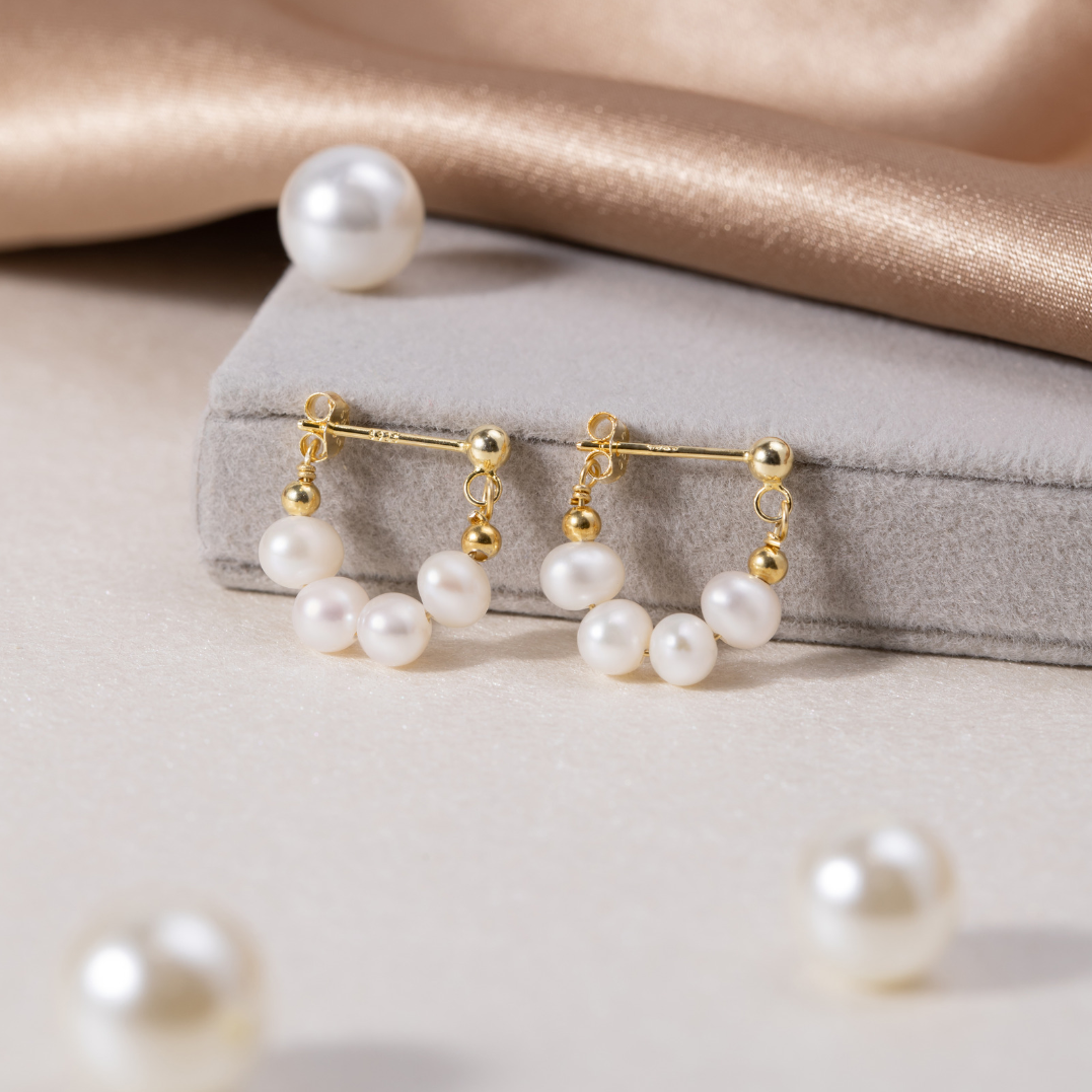 Yowe – Kreolen Perle von goldenem Glanz