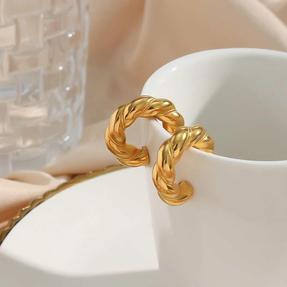 Carmen – Ohrringe aus vergoldetem Metall in Twist-Form